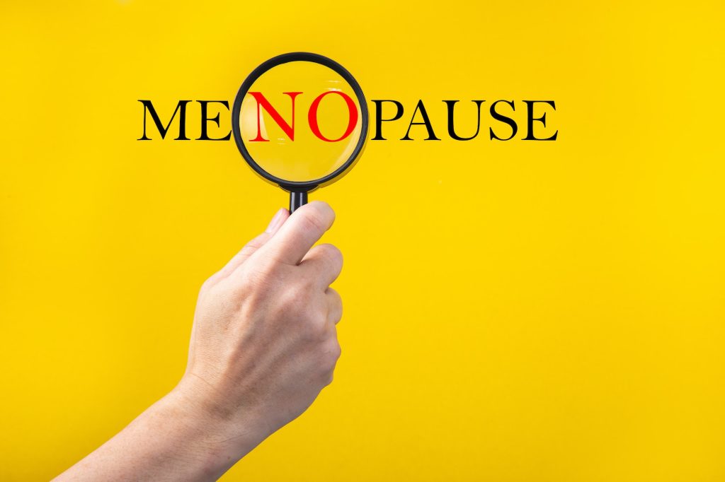 The word Menopause through a magnifying glass